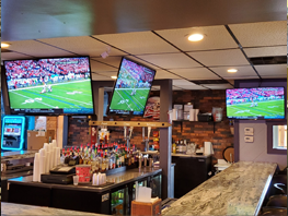TV's and bar at One More Pub & Grub